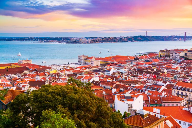 Sunset over Lisbon's Baixa district and the Tagus River
